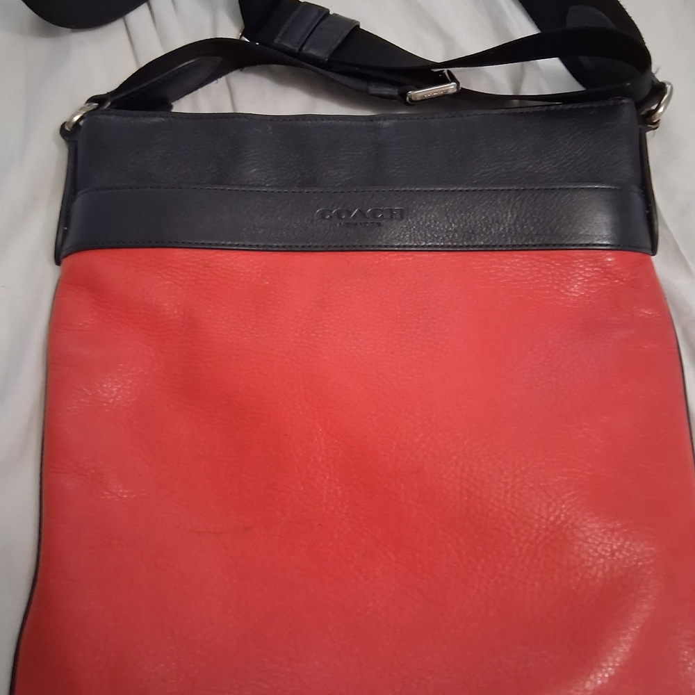 The item pictured appears to be a Coach leather crossbody or messenger bag in a